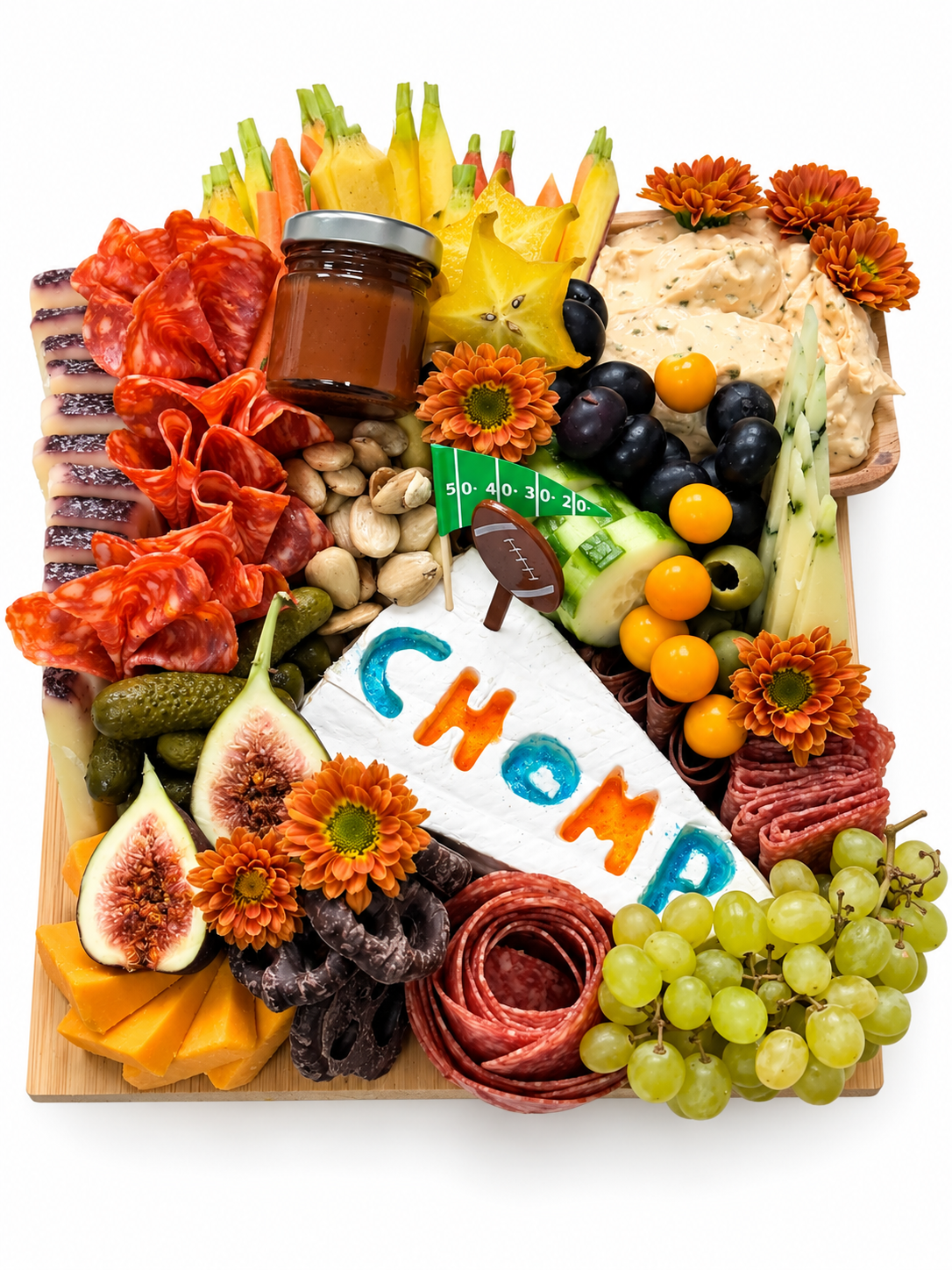 Custom themed 7 person charcuterie board with meats, cheeses, fruit and football decor